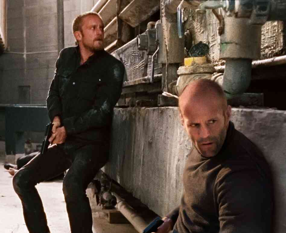 After discovering the truth about his mentor's murder, Arthur (Statham, foreground) takes on the man's troubled adult son (Ben Foster) as an  apprentice.