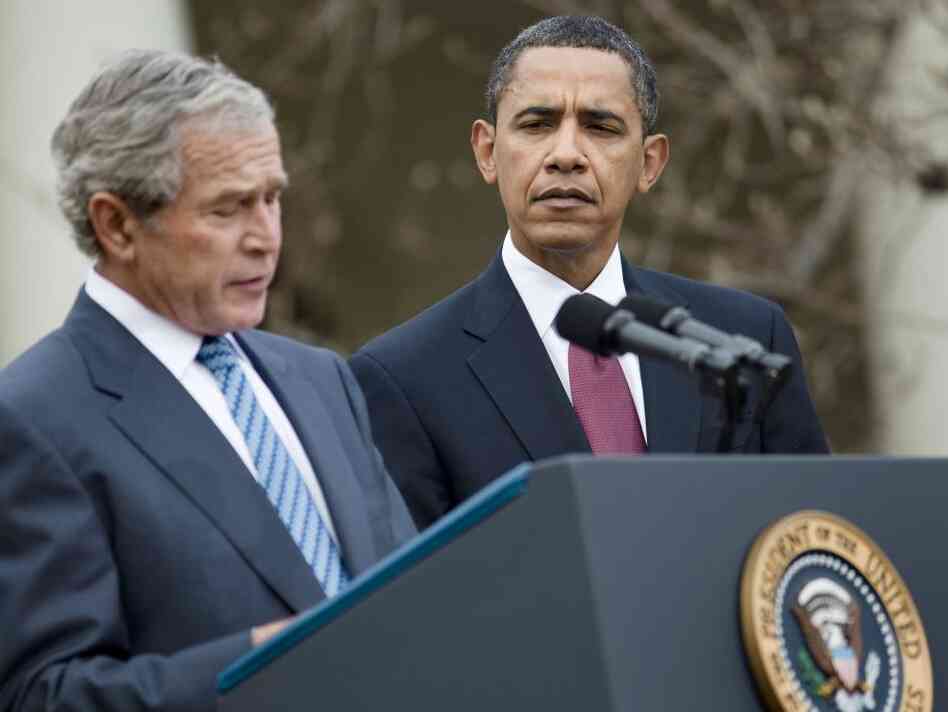 President Barack Obama listens as former President George W. Bush speaks during a press conference in the Rose Garden of the White House last January.