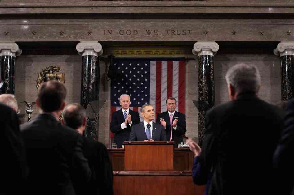 With Vice President Joe Biden and House Speaker John Boehner behind him, President Obama delivers his State of the Union speech Tuesday to a joint session of Congress on Capitol Hill. 