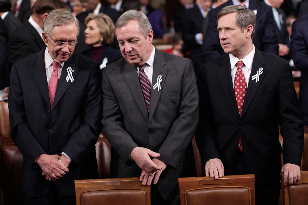 Senate Majority Leader Harry Reid (D-NV) and Senate Majority Whip Richard Durbin (D-IL) chat as they stand with Sen. Mark Kirk (R-IL). 