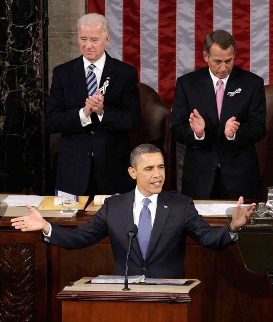 Vice President Biden and Speaker Boehner applaud as President Obama gestures before speaking. 