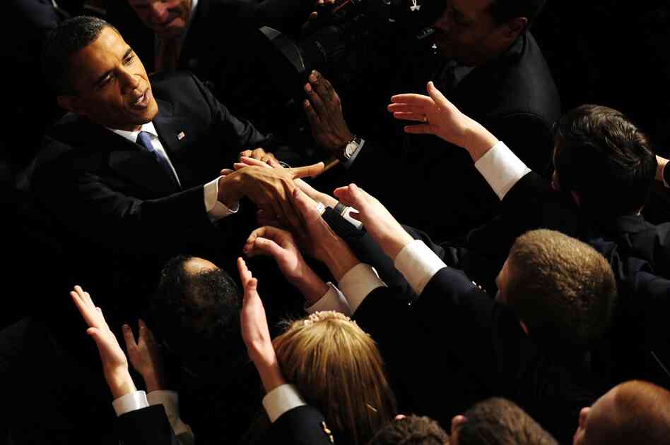 Obama is greeted following the address. 