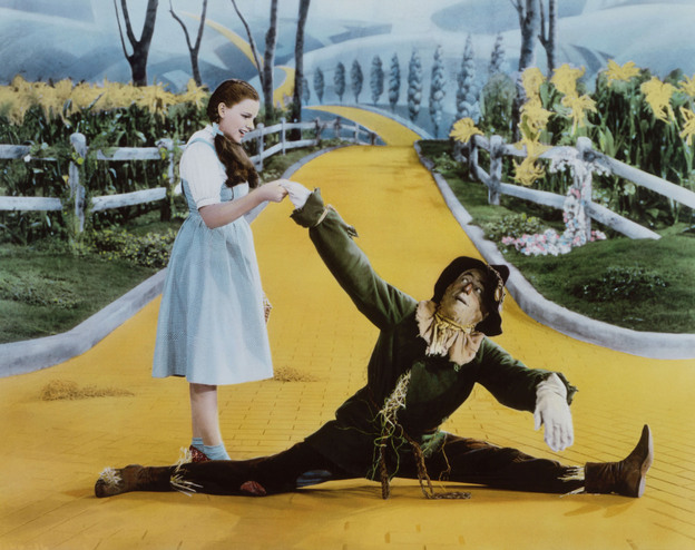 Dorothy and the scarecrow on the Yellow Brick Road, in a scene from the 1939 film 'The Wizard of Oz.'