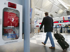 A traveler passes an automated external defibrillator at O'Hare International Airport in Chicago. A traveler passes an automated external defibrillator at O'Hare International Airport in Chicago.