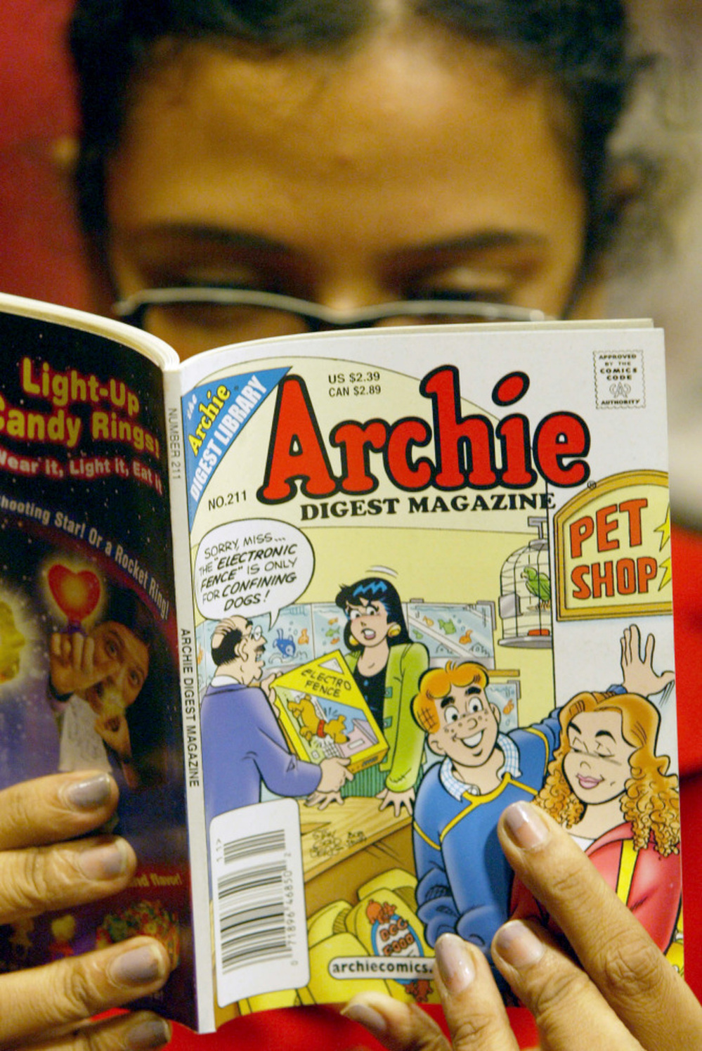 An enthusiast reads an Archie comic at Oxford Book Shop in Calcutta, India, Monday, May 7, 2007. Do you see, up in the corner? The upper right corner of the cover? See that tiny thing you can barely make out? That's the Comics Code Seal Of Approval.