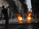 A demonstrator threw an object towards police during a protest Wednesday (Jan. 26, 2011) in Cairo. A demonstrator threw an object towards police during a protest Wednesday (Jan. 26, 2011) in Cairo.