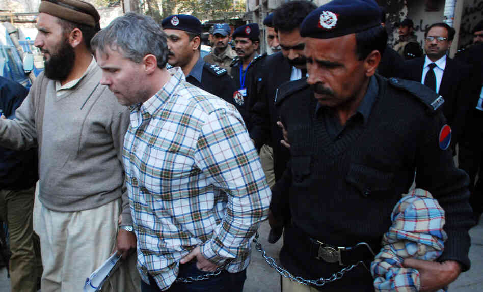 Pakistani police escorted the U.S. consular official, identified by local authorities as Raymond Davis, into court in the city of Lahore on Friday. Pakistani police escorted the U.S. consular official, identified by local authorities as Raymond Davis, into court in the city of Lahore on Friday.