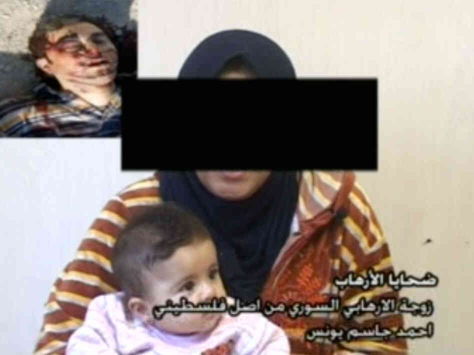 The Iraqi government recently launched an anti-al-Qaida media campaign that urges women not to marry insurgents. Seen here is a screen grab from a government video of one woman who married an insurgent. Her daughter, also pictured, is the child of a Palestinian-Syrian al-Qaida fighter who was killed by Iraqi forces. He is seen, dead, in the upper left of the screen. The Iraqi government recently launched an anti-al-Qaida media campaign that urges women not to marry insurgents. Seen here is a screen grab from a government video of one woman who married an insurgent. Her daughter, also pictured, is the child of a Palestinian-Syrian al-Qaida fighter who was killed by Iraqi forces. He is seen, dead, in the upper left of the screen.