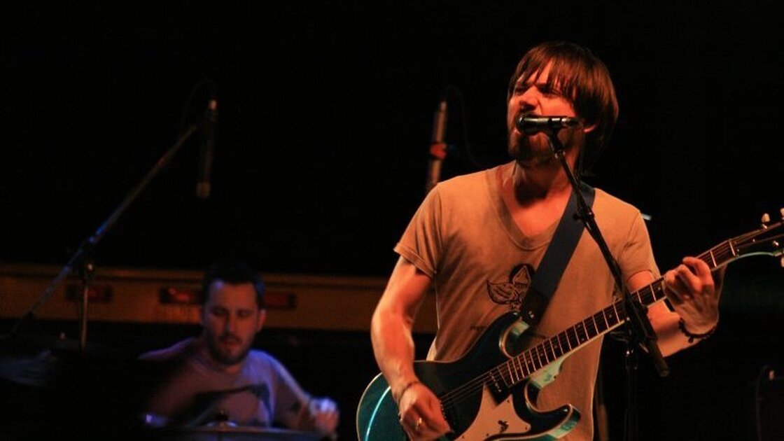 Matt Baum (left) and Conor  Oberst (right) of the band Desaparecidos perform at the benefit.