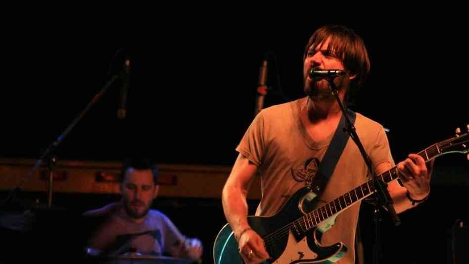 Matt Baum (left) and Conor  Oberst (right) of the band Desaparecidos perform at the benefit.