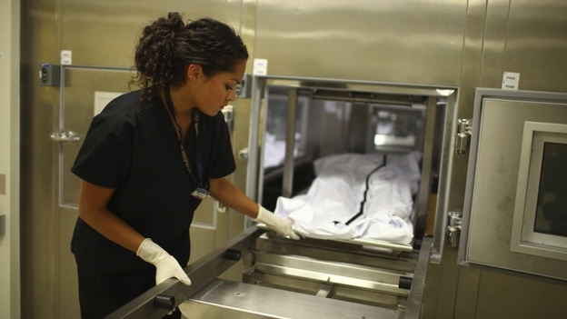 A morphology technician at   The New Mexico Office of the Medical Investigator stores one of the bodies that is autopsied there. The office was created by the state legislature in 1972 replacing the county coroner system.