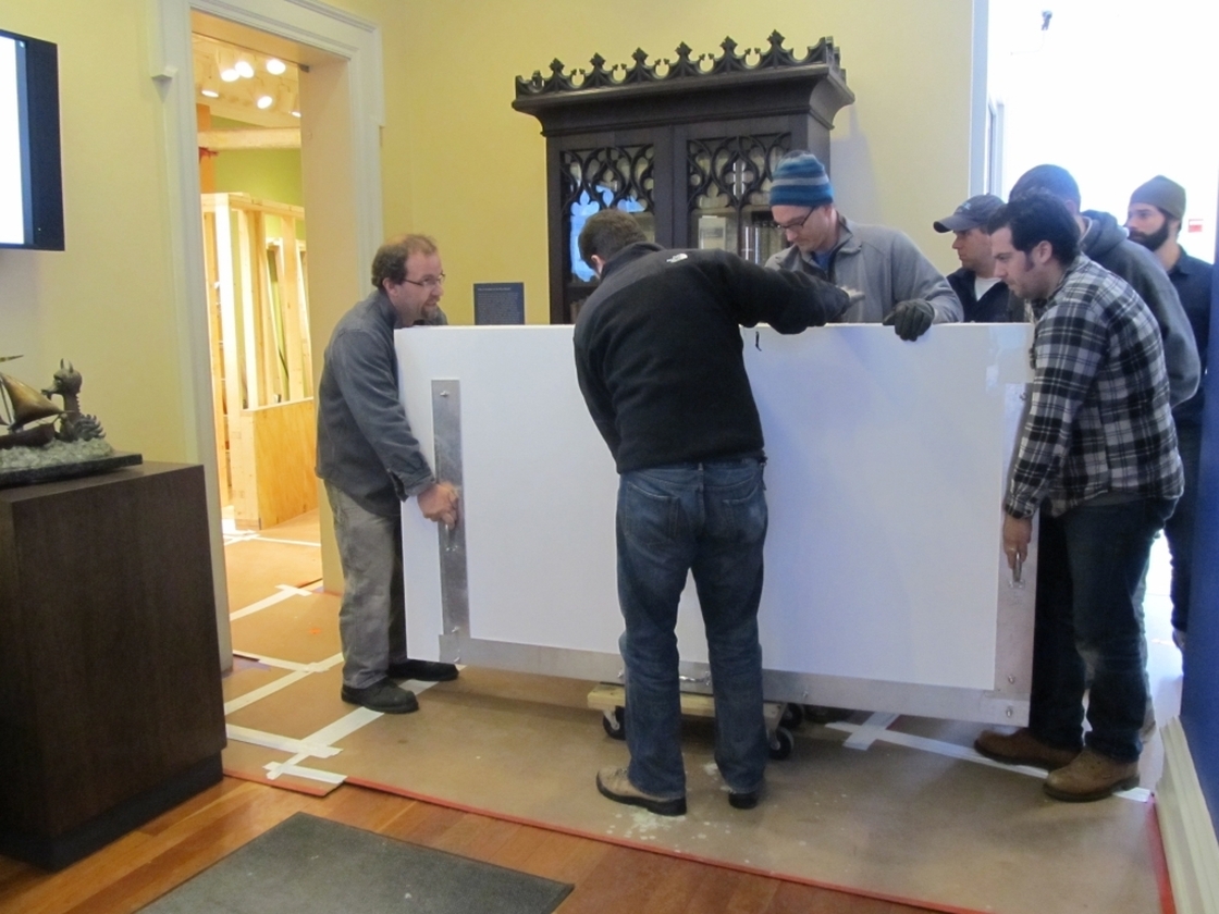 A team of eight art handlers and  conservators transported The Chertoff Mural from the truck into the Rosenbach Museum & Library's Maurice Sendak  Gallery.