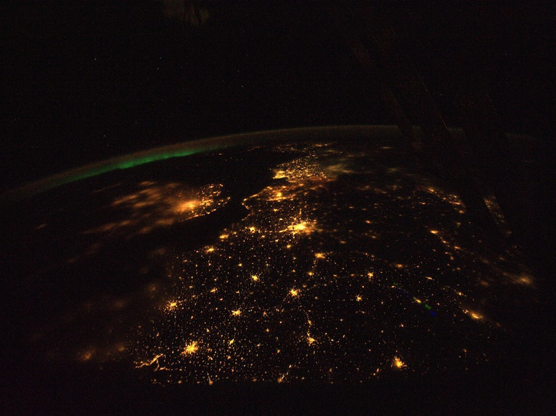 The English Channel,  shown here, lies between the light-polluted United  Kingdom, the smaller land mass to the left, and continental  Europe. London and its suburbs light up the image, just  left of center.