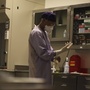 A forensic pathologist prepares for an autopsy at The New Mexico Office of the Medical Investigator.