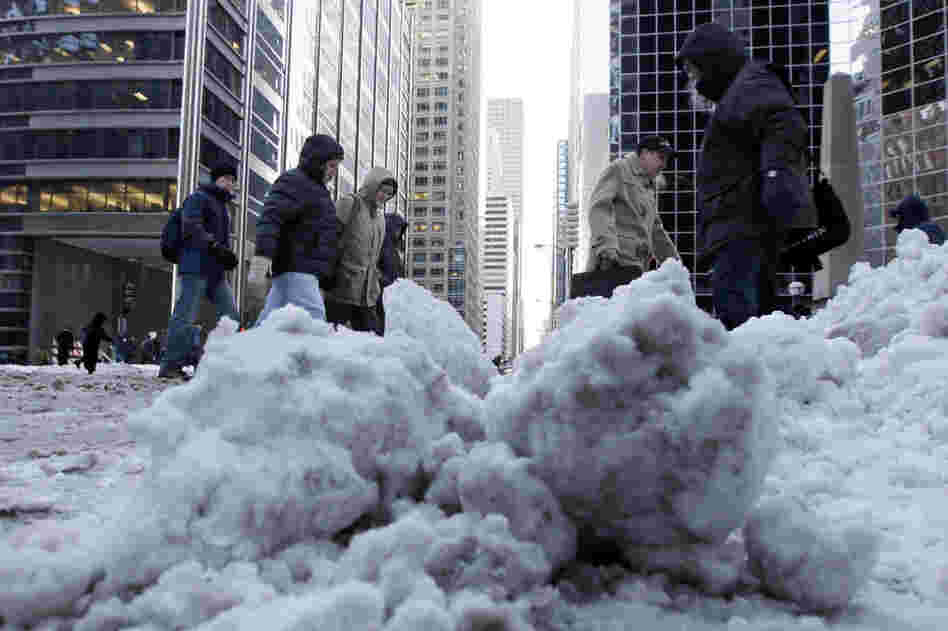 Commuters brave subzero wind chills as they return to work Thursday in Chicago.  