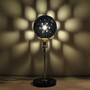 A lamp shade robot, an Auger-Loizeau Carnivorous Domestic Robot Entertainment design, is powered by incoming flies.
