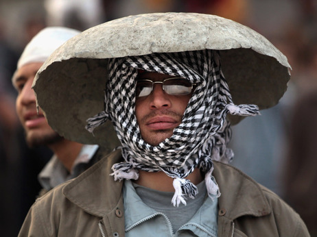 An anti-government protester in a makeshift helmet earlier today (Feb. 3, 2011) in Cairo.
