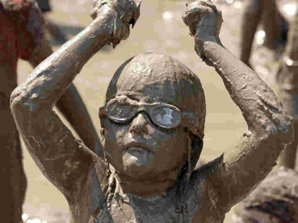 Not all young girls avoid dirt. Hannah Rose Akerley, 7, plays in a gigantic lake of mud at the annual Mud Day event in Westland, Mich., last July.