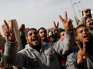 Egyptian men protest against the government of Egyptian president Hosni Mubarek during a march in central Tahrir Square Cairo. Many compare the unfolding situation to Iran circa 1979. Egyptian men protest against the government of Egyptian president Hosni Mubarek during a march in central Tahrir Square Cairo. Many compare the unfolding situation to Iran circa 1979.