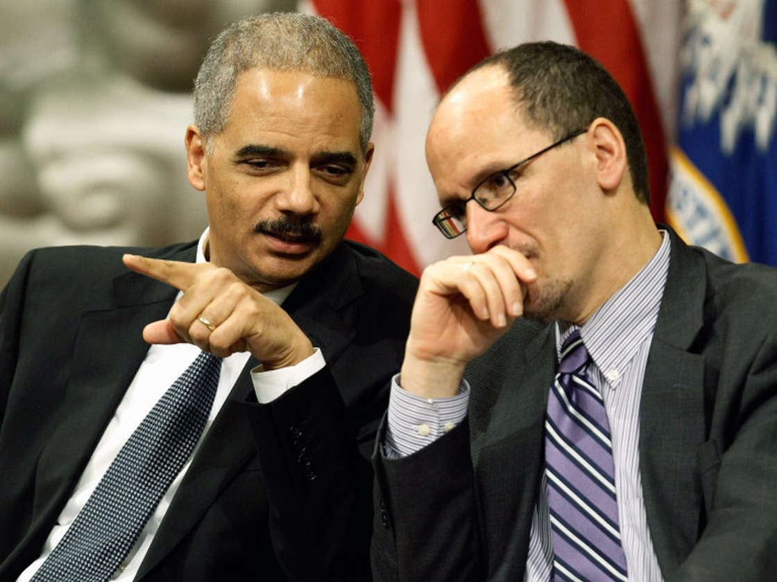 U.S. Attorney General Eric Holder (left) talks with Assistant Attorney General for Civil Rights Tom Perez during the Dr. Martin Luther King Jr. Commemorative Program at the Department of Justice on Jan. 11. The department is putting a focus on civil rights, including developing special units.