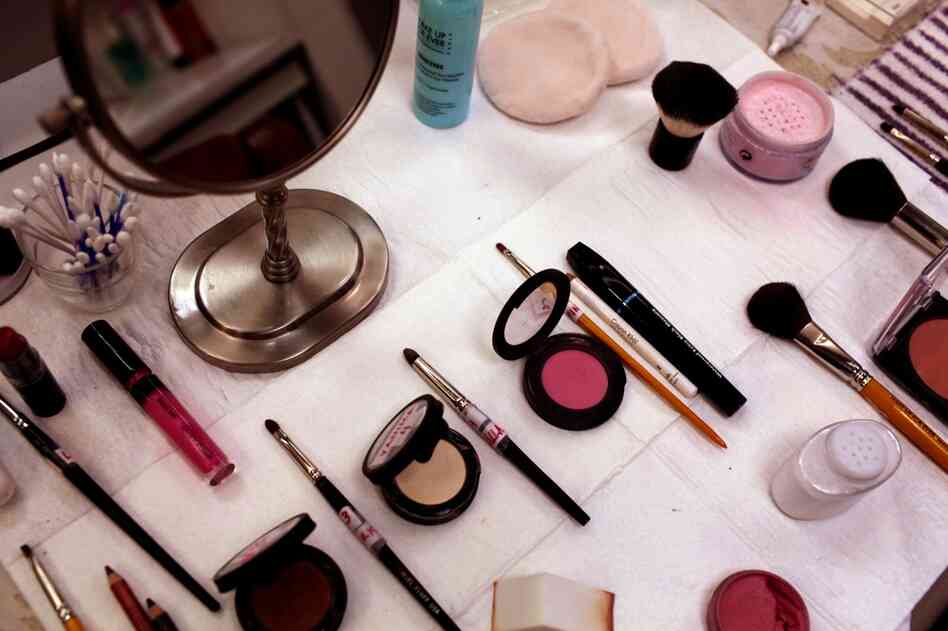 His dressers have laid out all the makeup in the order it's applied.