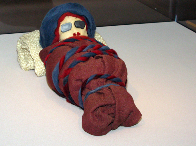 The stand-in mummies, including this infant mummy, were deployed in a last-minute rush by exhibit designer Kate Quinn and her staff.
