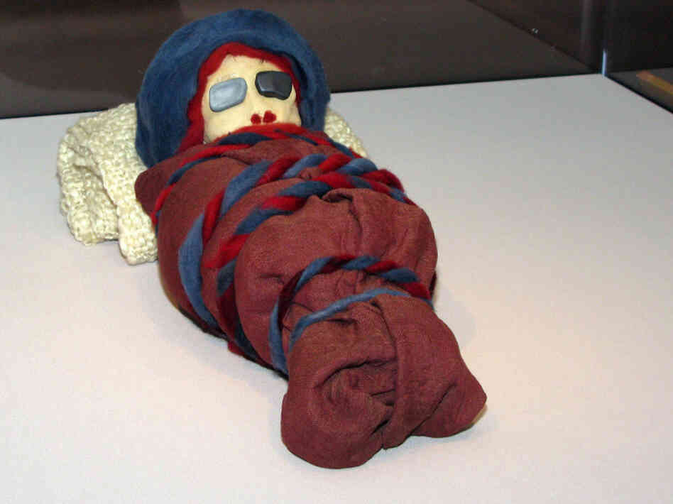The stand-in mummies, including this infant mummy, were deployed in a last-minute rush by exhibit designer Kate Quinn and her staff.
