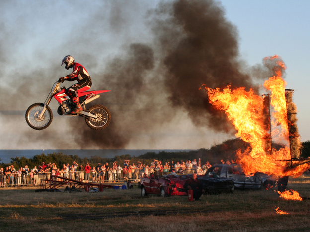 Hal Needham performed hundreds of death-defying stunts during a career that spanned over 40 years. Stuntmen, like the one pictured here, still use his innovative equipment, like the airbag and other safety features for car and aerial stunts.