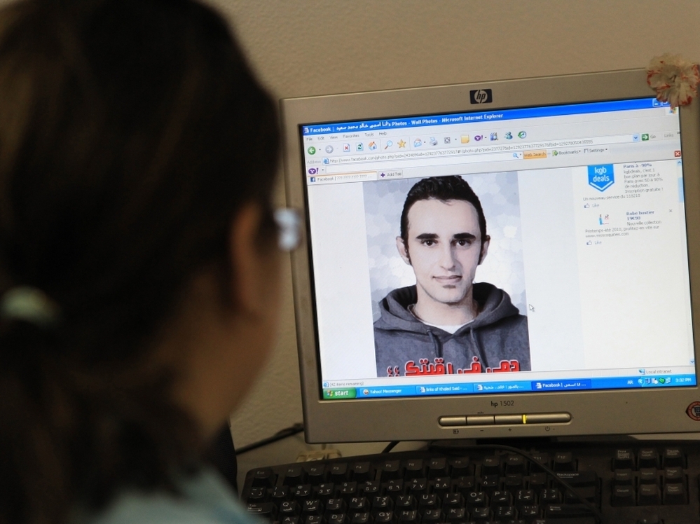 An Egyptian woman in Cairo in June previews a Facebook Web page showing a picture of Khaled Said, an Egyptian allegedly tortured to death by police in Alexandria.