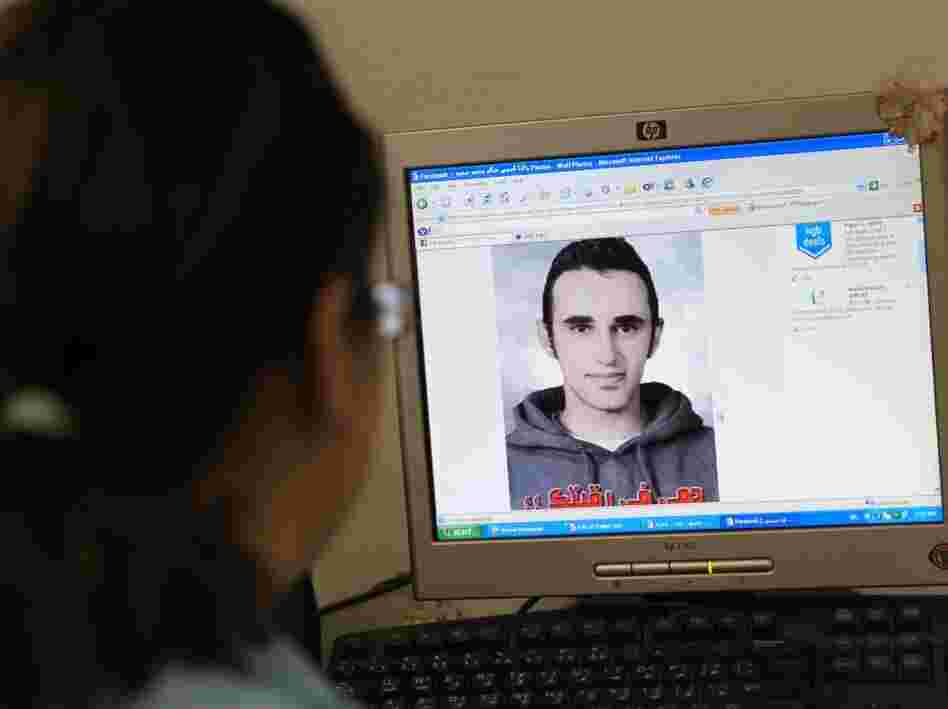 An Egyptian woman in Cairo in June previews a Facebook Web page showing a picture of Khaled Said, an Egyptian allegedly tortured to death by police in Alexandria.