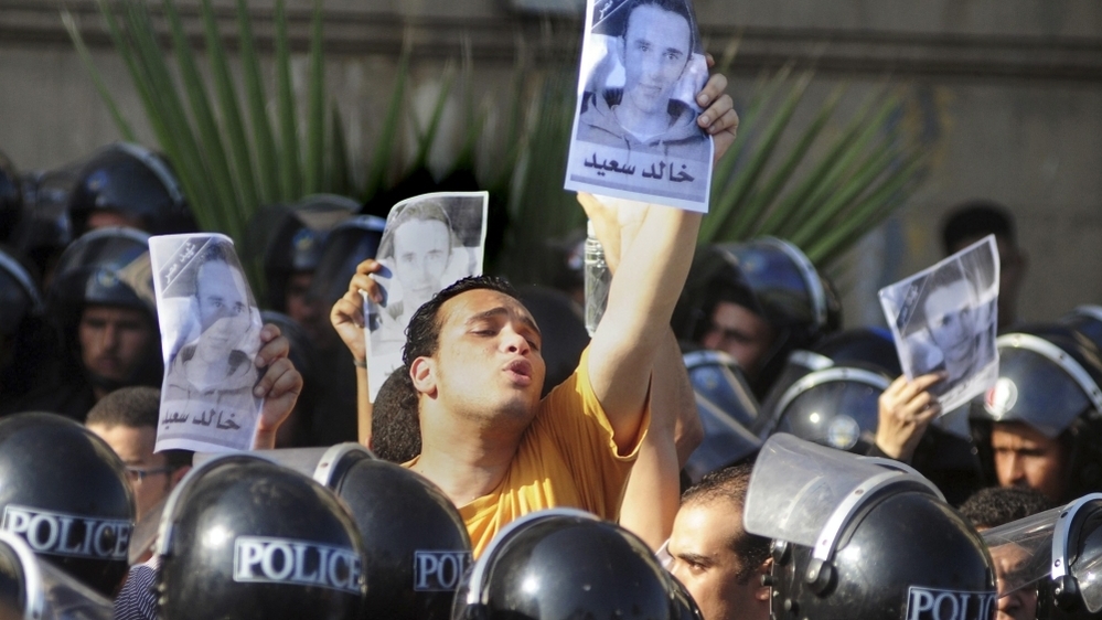 Egyptians shout anti-police slogans and hold up posters of 28-year-old  Khaled Said during a demonstration in Alexandria, Egypt, Sept.  25, 2010.
