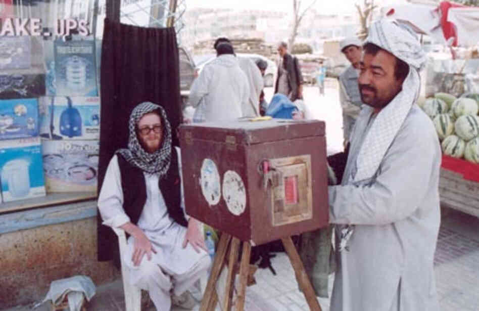 Lukas Birk's friend Sean has his photo taken by a street photographer in Mazar i Sharif in Northern Afghanistan.