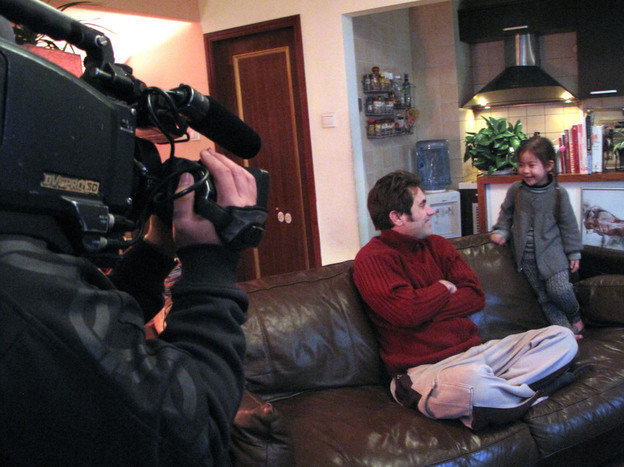 Jonathan Kos-Read and his daughter, Roxanne, being filmed by a Chinese  television show for a special on how famous people raise their kids.
