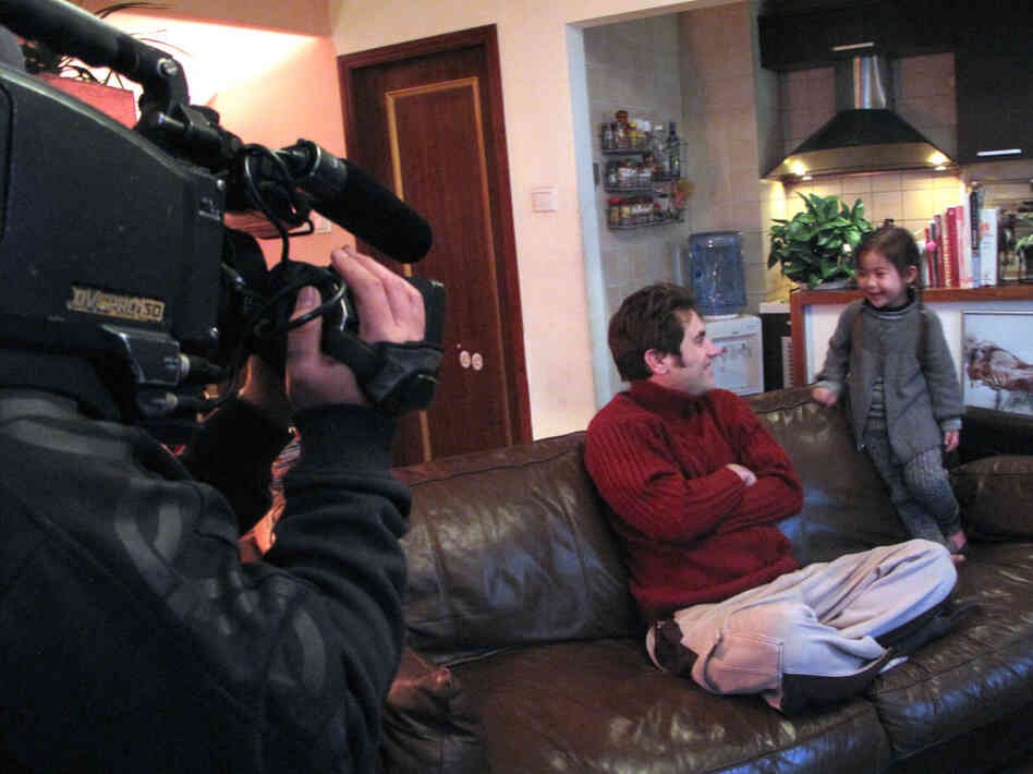 Jonathan Kos-Read and his daughter, Roxanne, being filmed by a Chinese  television show for a special on how famous people raise their kids.