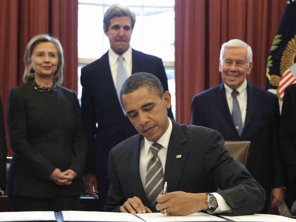President Obama signs the New START Treaty, Wednesday, Feb. 2, 2011 as Secretary of State Hillary Rodham Clinton, Sen. John Kerry (D-MA) and Sen. Richard Lugar (R-IN) watch.
