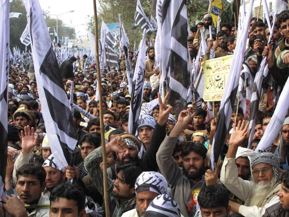 Crowds in Lahore, Pakistan, attend a rally organized by the banned Jamat-ud-Dawa. Although the rally in solidarity with the Muslims of Indian-controlled Kashmir, fiery speakers also condemned jailed U.S. diplomat Raymond Davis, who has been charged with double murder in connection with the shooting of two Pakistanis. The case has strained U.S.-Pakistani relations. Crowds in Lahore, Pakistan, attend a rally organized by the banned Jamat-ud-Dawa. Although the rally in solidarity with the Muslims of Indian-controlled Kashmir, fiery speakers also condemned jailed U.S. diplomat Raymond Davis, who has been charged with double murder in connection with the shooting of two Pakistanis. The case has strained U.S.-Pakistani relations.