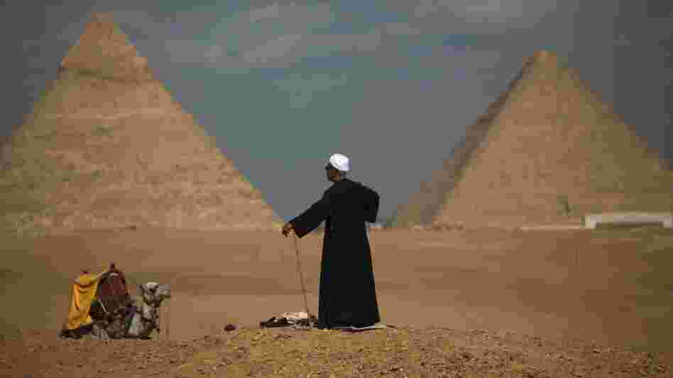 Egyptian camel driver Gamal, 54, waits for tourists near the pyramids,  in Giza, Egypt,  Jan. 31.