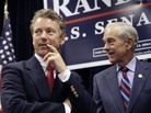 Rep. Ron Paul (R-TX) with his son Sen. Rand Paul (R-KY), October, 2010. Rep. Ron Paul (R-TX) with his son Sen. Rand Paul (R-KY), October, 2010.