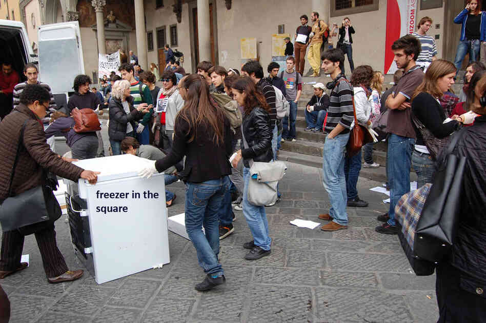 Bystanders are encouraged to participate by taking a figure and placing it as part of the intervention. 