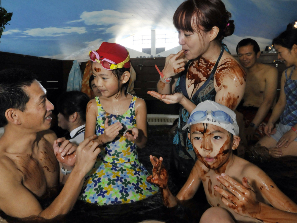 A family enjoys a dip in the "chocolate spa" at the Hakone Yunessun spa resort in Hakone, 60 miles west of Tokyo. Each year, the Yunessun offers the special spa to mark Valentine's Day.