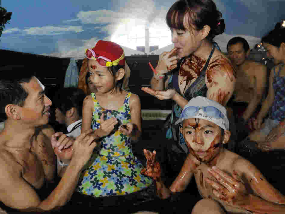 A family enjoys a dip in the "chocolate spa" at the Hakone Yunessun spa resort in Hakone, 60 miles west of Tokyo. Each year, the Yunessun offers the special spa to mark Valentine's Day.
