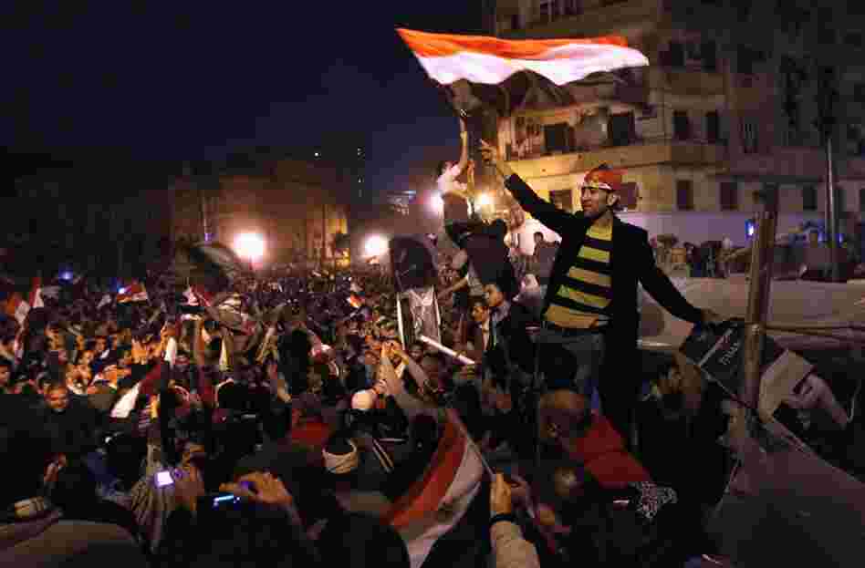 Egyptians celebrate in Tahrir Square after hearing the news of the resignation of President Hosni Mubarak on Friday. 