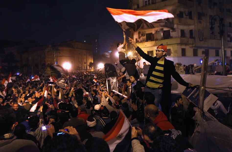 Egyptians celebrate in Tahrir Square after hearing the news of the resignation of President Hosni Mubarak on Friday. 