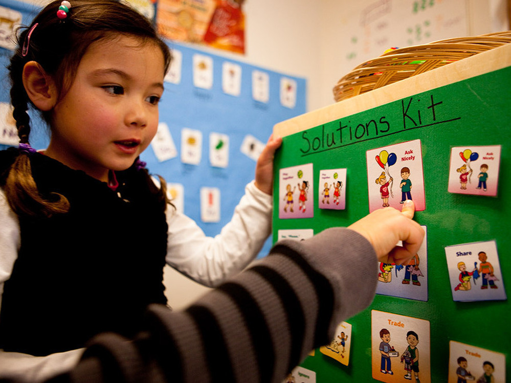 Liya Pomfret and Rowan Miller demonstrate how they use the "solutions kit" to resolve conflicts.