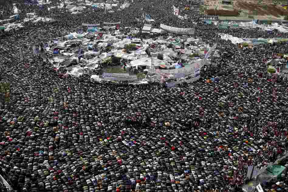 Protesters take a break for prayer amid the protests in Tahrir Square on Friday. 