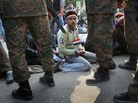 Egyptians stage a sit-in after the army ordered their encampments torn down in Tahrir Square on Sunday. Egyptians stage a sit-in after the army ordered their encampments torn down in Tahrir Square on Sunday.