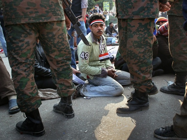 Egyptians stage a sit-in after the army ordered their encampments torn down in Tahrir Square on Sunday.