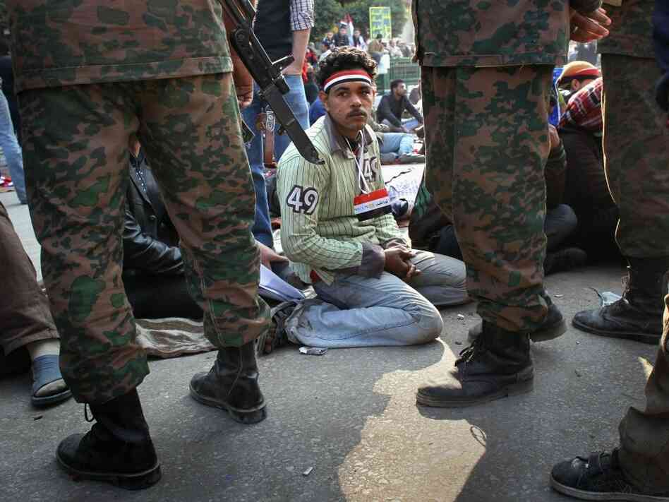 Egyptians stage a sit-in after the army ordered their encampments torn down in Tahrir Square on Sunday.