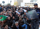 Protesters gather in front of police officers during a demonstration in Algiers, Algeria, on Saturday. Protesters gather in front of police officers during a demonstration in Algiers, Algeria, on Saturday.