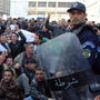 Protesters gather in front of police officers during a demonstration in Algiers, Algeria, on Saturday. Protesters gather in front of police officers during a demonstration in Algiers, Algeria, on Saturday.
